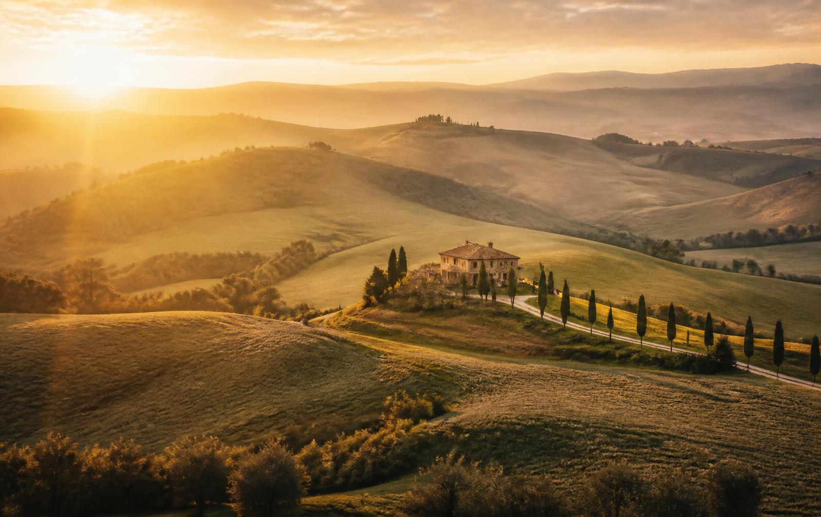 Val d'Orcia landscape at golden hour with a stone farmhouse and cypress-lined road